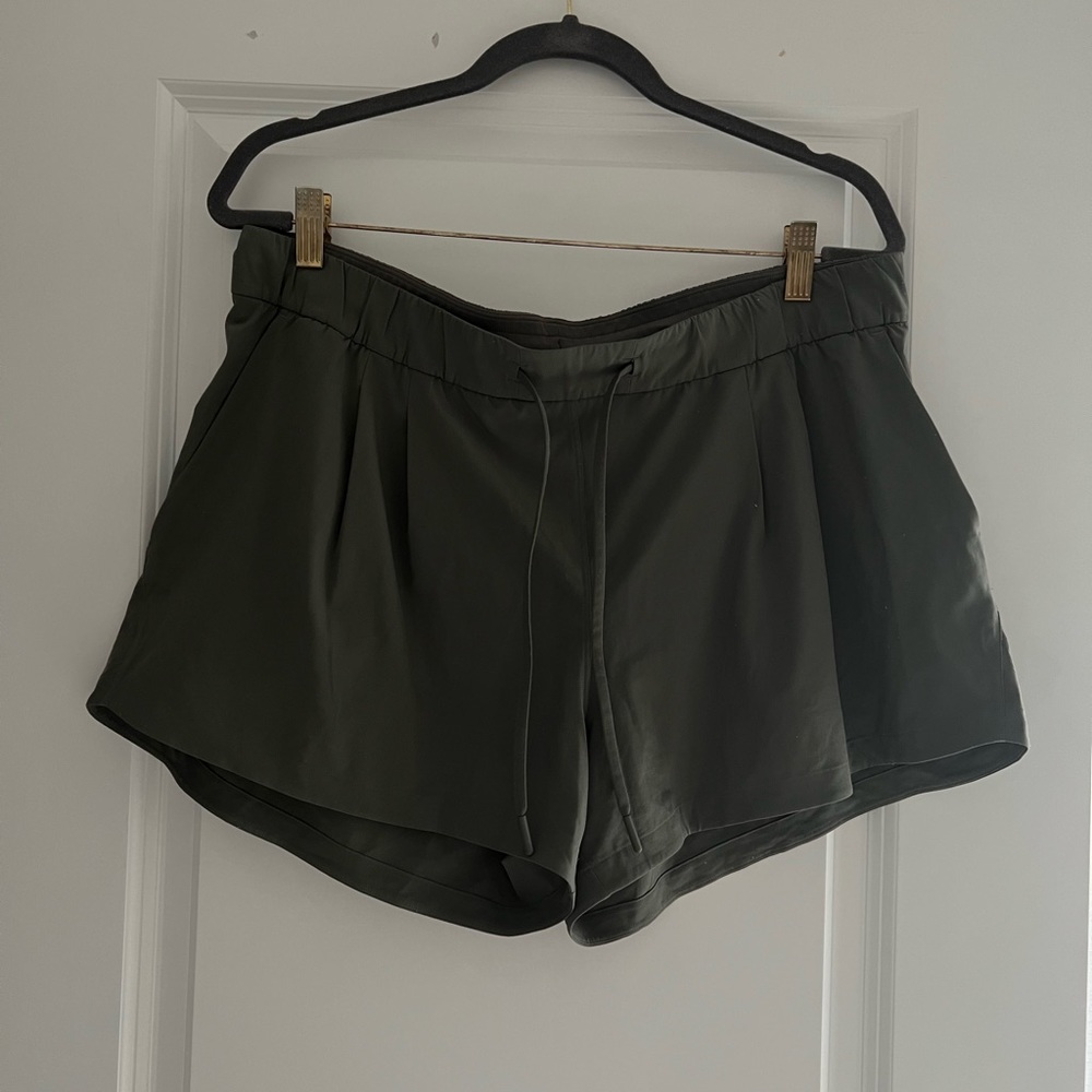 Deep green Lululemon relaxed shorts; size 8
